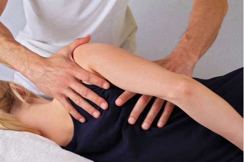 Chiropractor doing adjustment on woman’s back pain relief concept