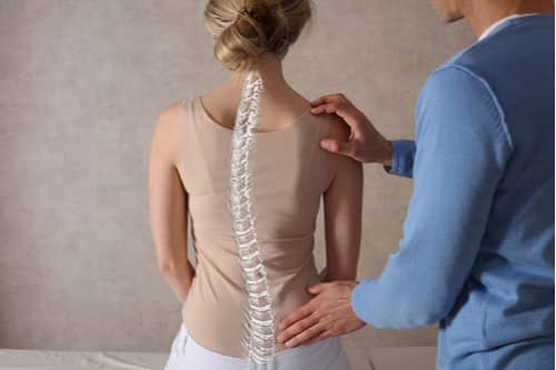 Doctor exam for spine pain treatment in Greenville SC